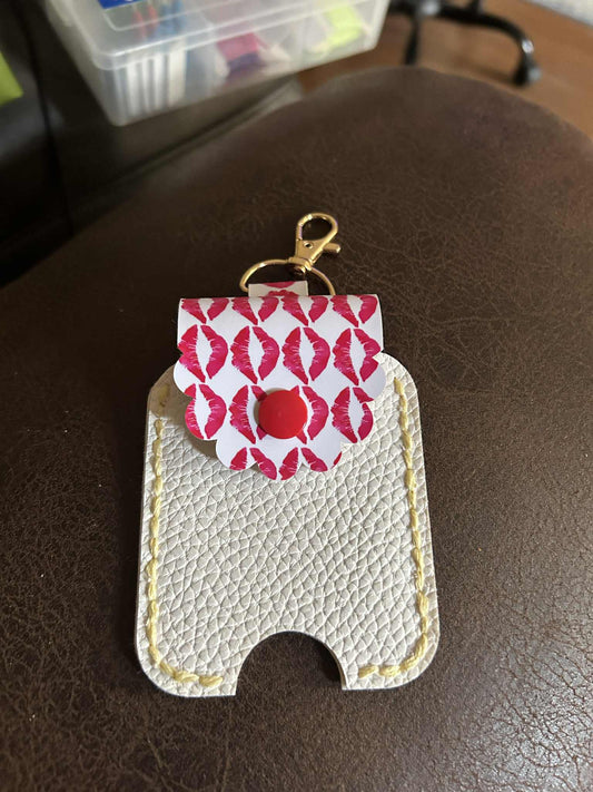 Lips and white rounded faux leather 2oz hand sanitizer holder