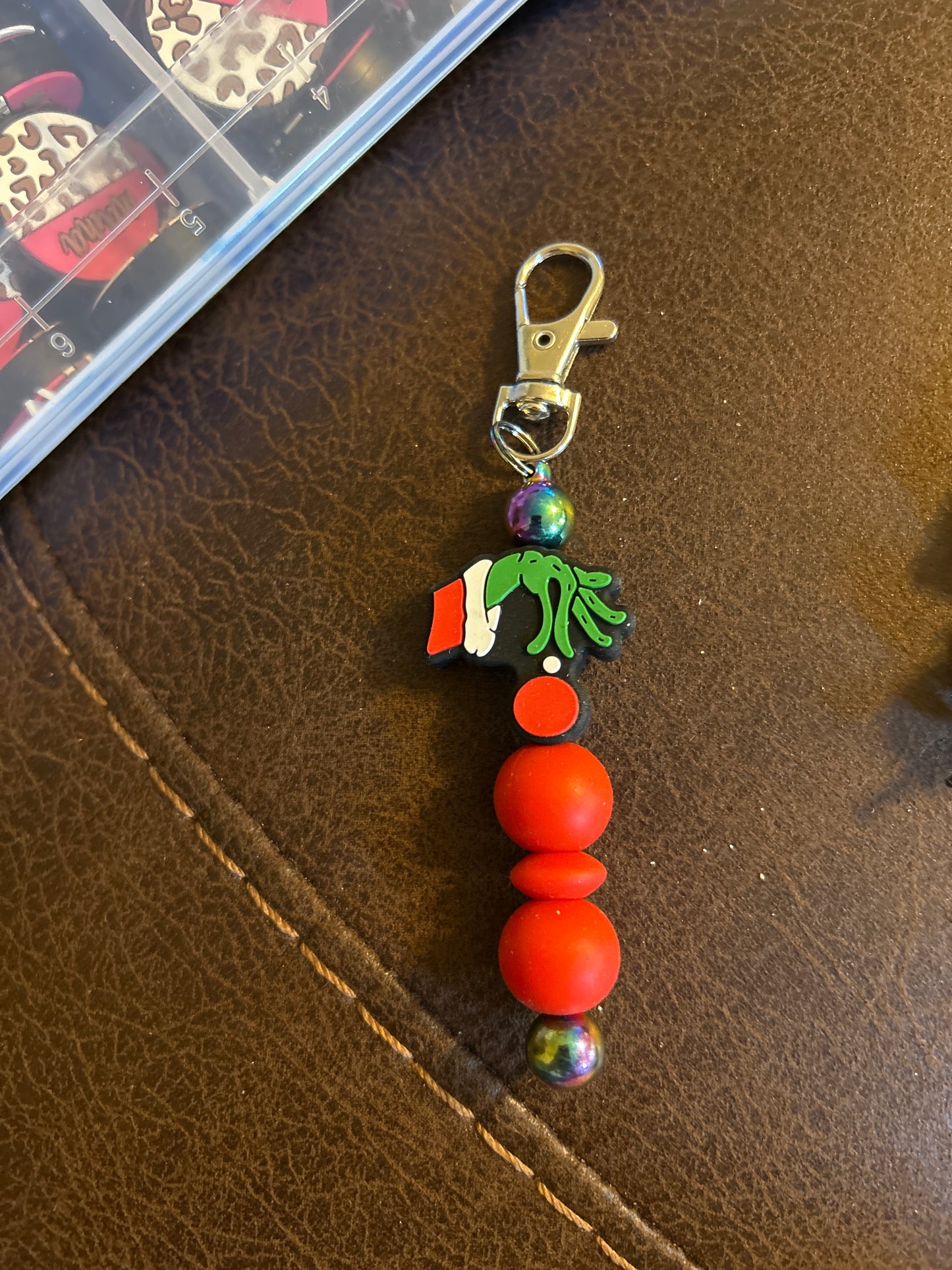 Grinch Hand Holding An Ornament