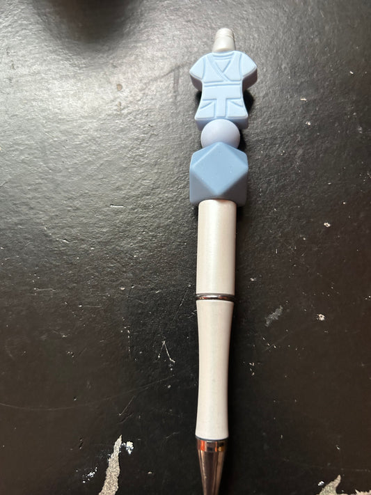Light blue scrub top pen