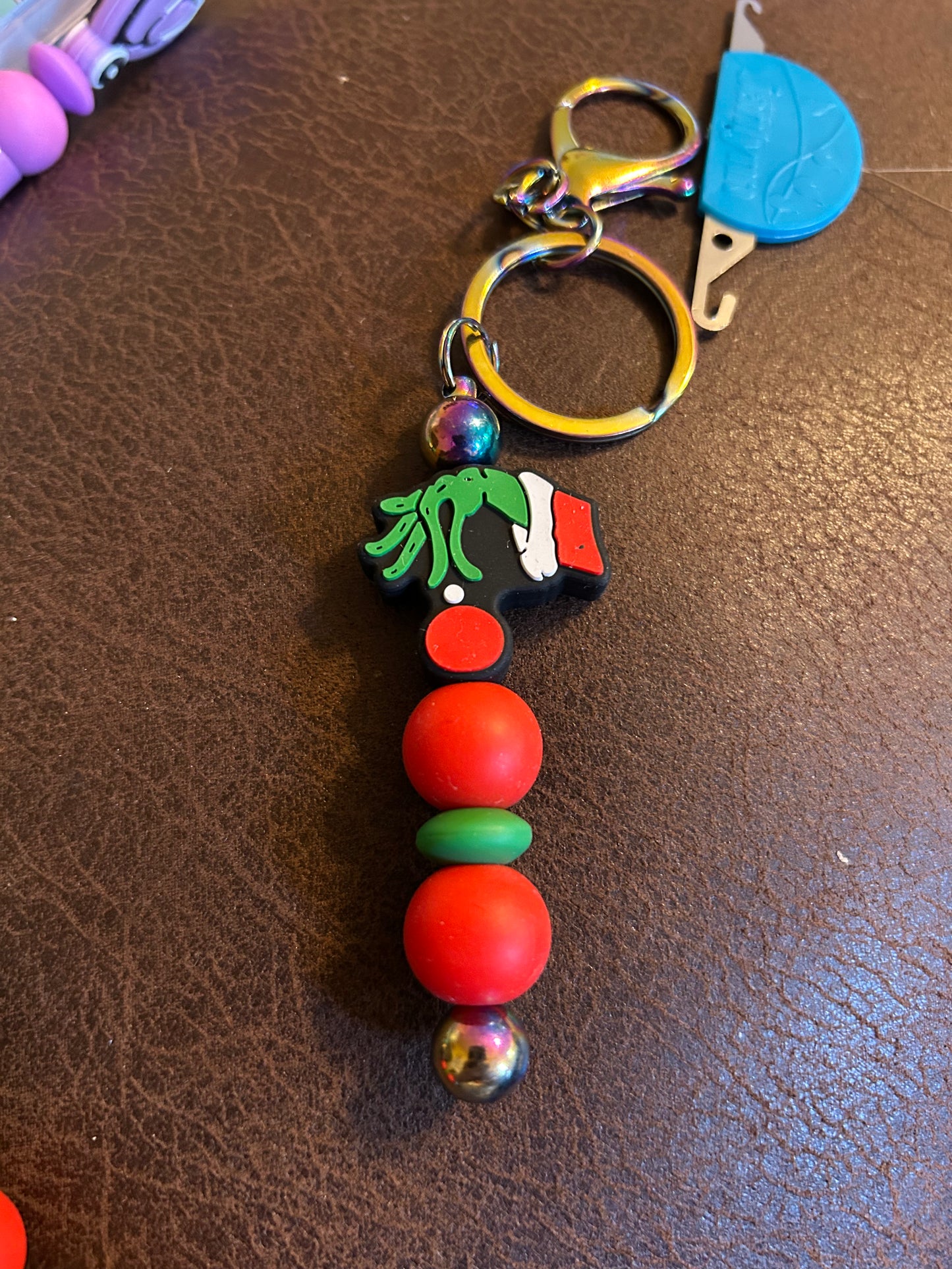 Grinch Hand Holding An Ornament